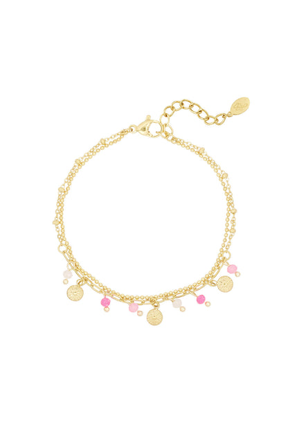 Armband met muntjes en kralen - roze/Goud kleur 