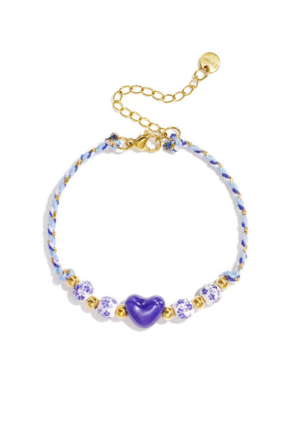 Gevlochten armband met kralen met design en hart