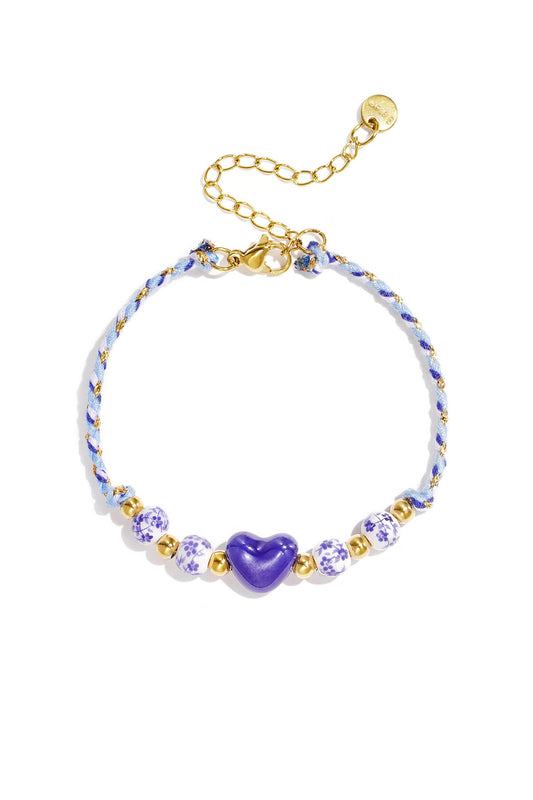Gevlochten armband met kralen met design en hart