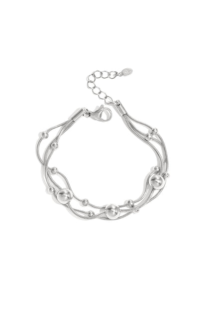 Armband met kettingen en polkadots